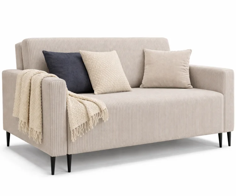 Beżowa sofa LAURA GERMAN z poduszkami na białym tle