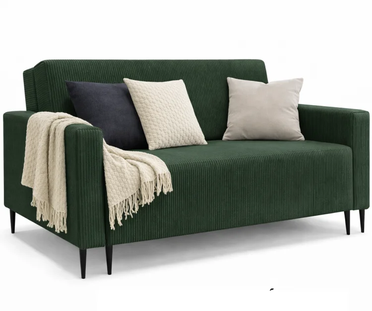Zielona sofa LAURA GERMAN z poduszkami na białym tle
