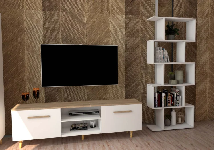 Biały regał MODE GERMAN z asymetrycznymi półkami, w salonie obok telewizora.