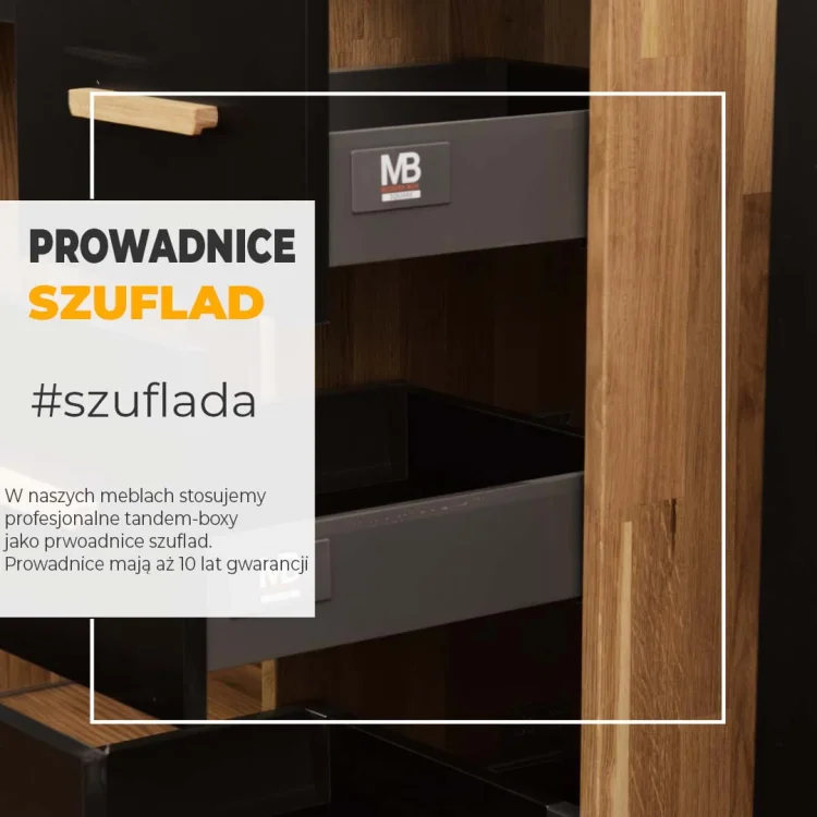 Zbliżenie wysuniętych szuflad meblowych z informacją o prowadnicach.